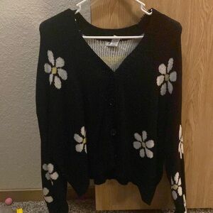 Black sweater with daisies